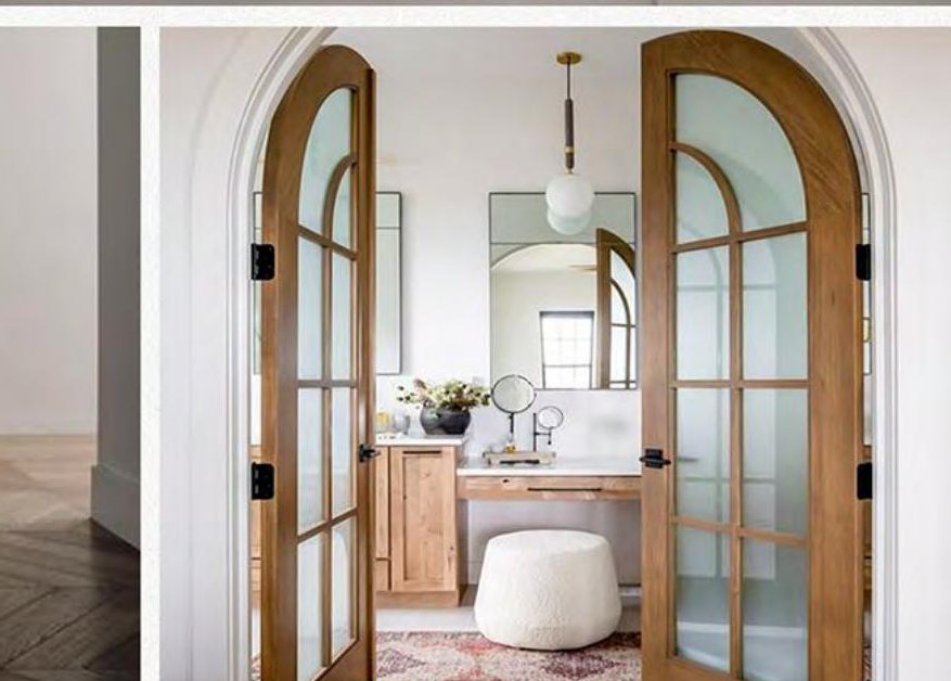 Primary suite: arched doors to the bath