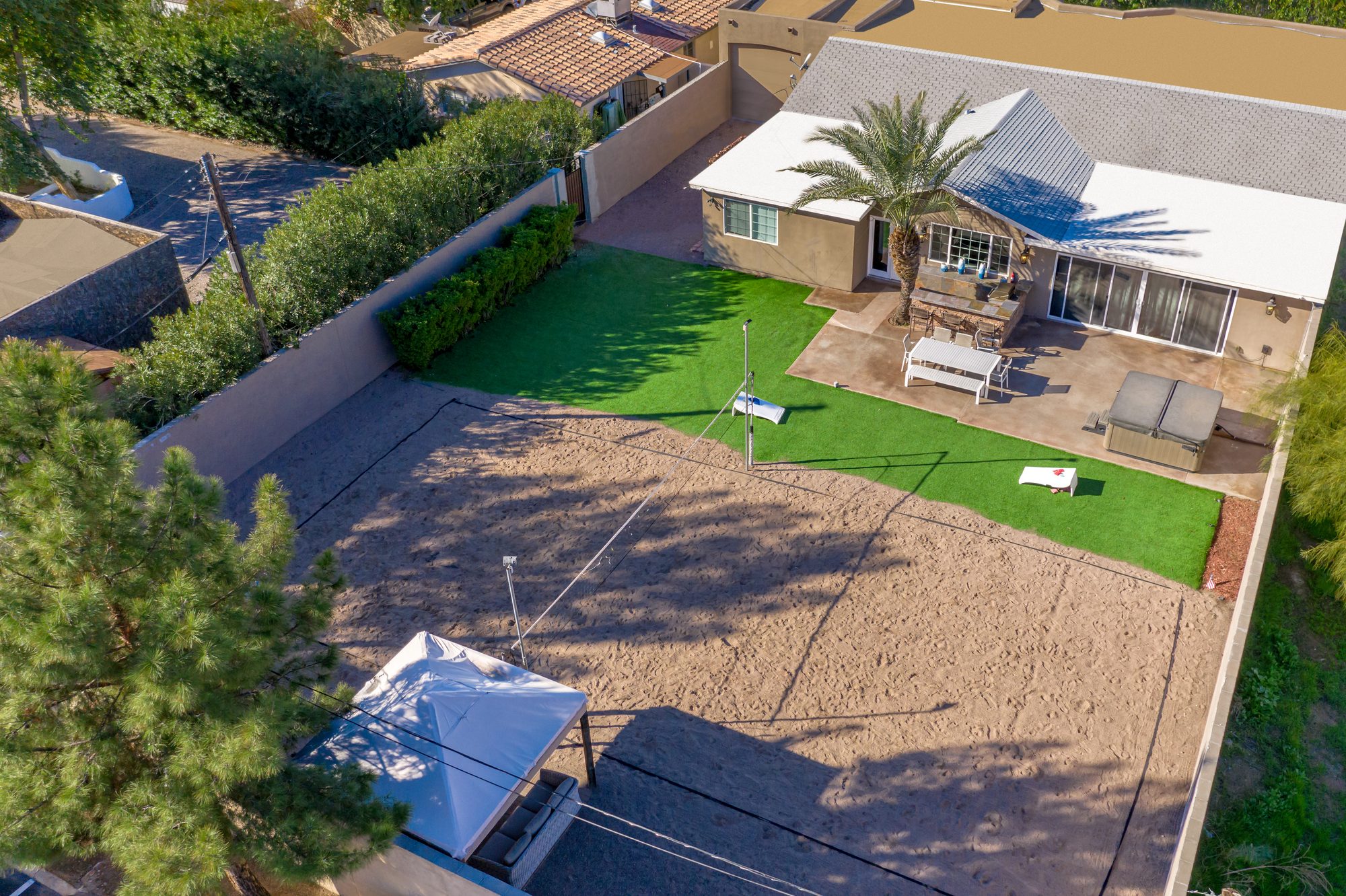 The lot in 2020, laid out as a sand court beside the estate